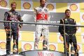 Das Podium in Spa mit Sebastian Vettel. Jenson Button und Kimi Räikkönen